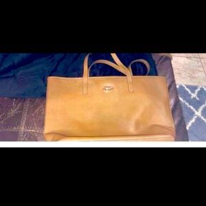 Michael Kors real Brown purse has a lot of storage space.